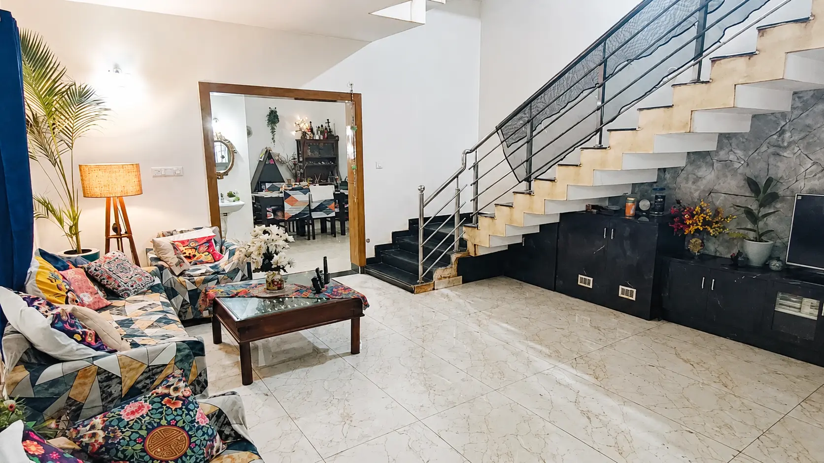 The Stay Floofy living room and staircase
